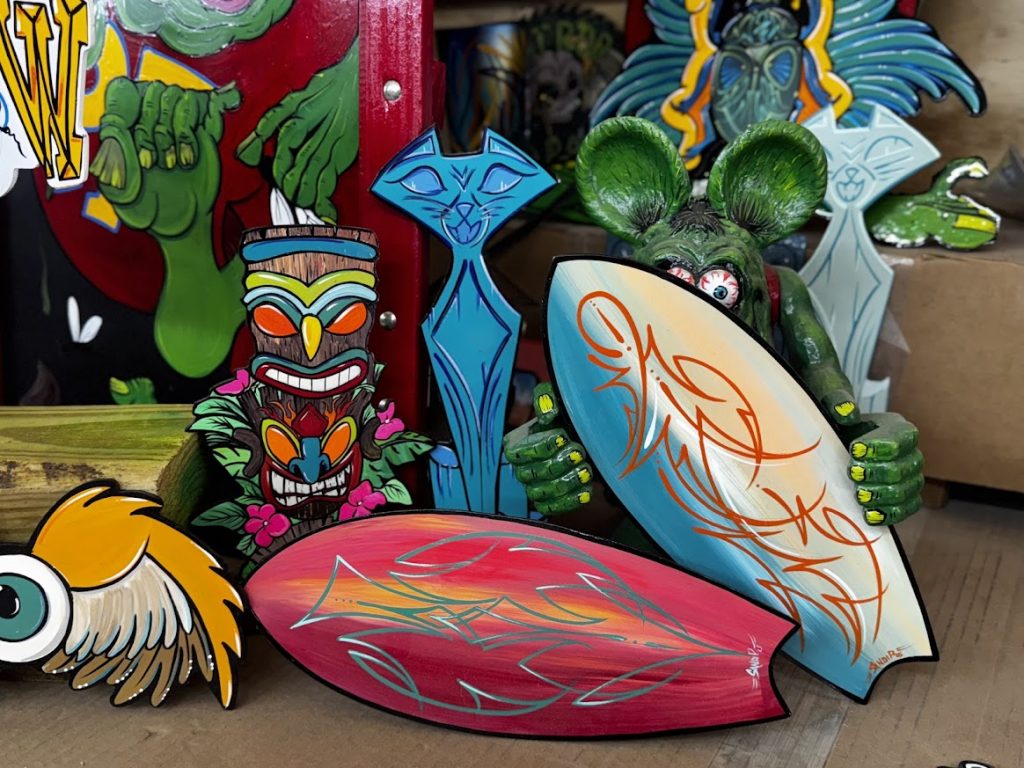 “Hand‑painted pinstripe panel art in traditional hot‑rod style”