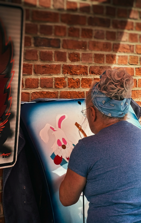 “Hand‑painted hot‑rod pinstriping by Sandi P in Granby Missouri.”